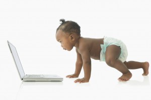 Baby looking at laptop